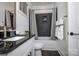 Cozy bathroom featuring a shower with dark tile, granite countertops, and modern fixtures at 411 Newstyle Way # 4, Cramerton, NC 28056