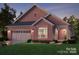 Beautiful rendering of a brick home with a two-car garage and charming curb appeal at 411 Newstyle Way # 4, Cramerton, NC 28056