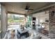 Relaxing screened porch featuring brick pillars, patio furniture, and sliding glass doors to the living room at 411 Newstyle Way # 4, Cramerton, NC 28056