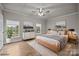 Bright bedroom with natural light, a modern ceiling fan and minimalist decor at 4759 Mel Nunnery Rd, Fort Lawn, SC 29714