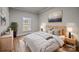 Virtually staged bedroom with light wood furniture and a neutral color scheme at 4759 Mel Nunnery Rd, Fort Lawn, SC 29714