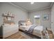 Virtually staged bedroom featuring white dresser and gray bed at 4759 Mel Nunnery Rd, Fort Lawn, SC 29714