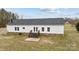 Rear view of a white house with a large yard at 4759 Mel Nunnery Rd, Fort Lawn, SC 29714