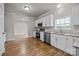 Well-lit kitchen featuring stainless steel appliances, granite countertops, and wooden flooring at 4759 Mel Nunnery Rd, Fort Lawn, SC 29714