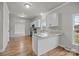 Modern kitchen with white cabinets, granite countertops, and stainless steel appliances at 4759 Mel Nunnery Rd, Fort Lawn, SC 29714