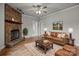 Living room with a stone fireplace and a brown leather sofa at 4759 Mel Nunnery Rd, Fort Lawn, SC 29714