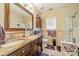 Bathroom with a double sink vanity and a glass-enclosed shower at 5218 Haybridge Rd, Charlotte, NC 28269