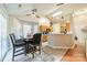 A bright dining room with a table set for four, with views of the kitchen at 5218 Haybridge Rd, Charlotte, NC 28269