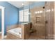 Spa-like bathroom with soaking tub and walk-in shower at 7708 Spanish Oaks Dr, Waxhaw, NC 28173