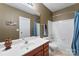 Clean bathroom with single vanity and bathtub shower combo at 7708 Spanish Oaks Dr, Waxhaw, NC 28173