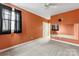 Bedroom with orange walls and built-in shelving at 7708 Spanish Oaks Dr, Waxhaw, NC 28173