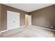 Bedroom with neutral walls and double doors to closet at 7708 Spanish Oaks Dr, Waxhaw, NC 28173