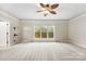 Spacious bedroom with ceiling fan and large windows at 7708 Spanish Oaks Dr, Waxhaw, NC 28173