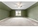 Spacious bedroom with ceiling fan and large window at 7708 Spanish Oaks Dr, Waxhaw, NC 28173