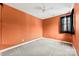 Bedroom with orange walls and ceiling fan at 7708 Spanish Oaks Dr, Waxhaw, NC 28173