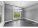 Breakfast area with dark gray walls and tile floors at 7708 Spanish Oaks Dr, Waxhaw, NC 28173