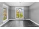 Bright dining room featuring hardwood floors and large windows at 7708 Spanish Oaks Dr, Waxhaw, NC 28173