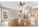 Open living area with hardwood floors, fireplace, and lots of natural light at 7708 Spanish Oaks Dr, Waxhaw, NC 28173