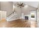 Spacious living room featuring high ceilings, a cozy fireplace, and hardwood floors at 7708 Spanish Oaks Dr, Waxhaw, NC 28173