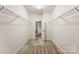 Spacious walk-in closet with ample shelving at 7708 Spanish Oaks Dr, Waxhaw, NC 28173