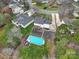 Aerial view showing house, pool, and surrounding neighborhood at 7721 Sedgebrook E Dr, Stanley, NC 28164