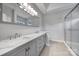 Elegant bathroom with double vanity and walk-in shower at 7721 Sedgebrook E Dr, Stanley, NC 28164