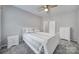 Comfortable bedroom with ceiling fan and white dresser at 7721 Sedgebrook E Dr, Stanley, NC 28164