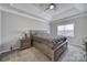 Bedroom with carpeted floors and large window at 7721 Sedgebrook E Dr, Stanley, NC 28164