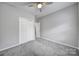 Simple bedroom with gray walls and carpet at 7721 Sedgebrook E Dr, Stanley, NC 28164