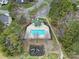 Community pool and playground with surrounding green space at 7721 Sedgebrook E Dr, Stanley, NC 28164