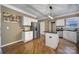 Updated kitchen featuring white cabinets, granite countertops, and stainless steel appliances at 7721 Sedgebrook E Dr, Stanley, NC 28164