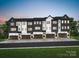 Row of modern townhomes with dark gray and white exterior, and 2-car garages at 7932 Cedarsmith Ct, Charlotte, NC 28217