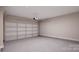 Spacious garage with automatic garage door and storage at 7932 Cedarsmith Ct, Charlotte, NC 28217