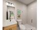 Clean bathroom with shower, toilet, sink, and light colored tile at 8008 Cedarsmith Ct, Charlotte, NC 28217