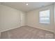 Comfortable bedroom with a window providing natural light and plush carpeting at 827 Blue Canyon Dr, York, SC 29745