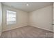 Neutral bedroom with carpeting, one window, and neutral paint at 827 Blue Canyon Dr, York, SC 29745