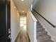 Inviting foyer with wood-look floors, a staircase with carpet, and natural light at 827 Blue Canyon Dr, York, SC 29745