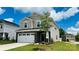Charming two-story home featuring a stone facade and well-manicured front lawn, offering great curb appeal at 827 Blue Canyon Dr, York, SC 29745