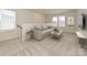 Comfortable loft area with plush carpeting and natural light, perfect for a media room or study at 827 Blue Canyon Dr, York, SC 29745