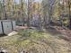 Spacious backyard with storage shed and wooded area at 8905 Vagabond Rd, Charlotte, NC 28227