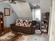 Multipurpose room with couch, shelving, and a cowhide rug at 8905 Vagabond Rd, Charlotte, NC 28227