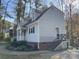 Side view of charming house with gray siding and steps at 8905 Vagabond Rd, Charlotte, NC 28227