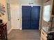 Hallway with blue interior doors and white trim at 8905 Vagabond Rd, Charlotte, NC 28227