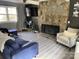 Bright living room showcasing a stone fireplace and comfortable furniture at 8905 Vagabond Rd, Charlotte, NC 28227