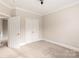 Spacious bedroom with double doors leading to a large closet at 9042 Summer Club Rd, Charlotte, NC 28277