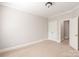 Neutral bedroom with double door closet and carpet flooring at 9042 Summer Club Rd, Charlotte, NC 28277