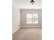 Simple bedroom with neutral walls and carpet flooring at 9042 Summer Club Rd, Charlotte, NC 28277