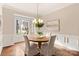 Formal dining room with a charming round table and ample natural light at 9042 Summer Club Rd, Charlotte, NC 28277