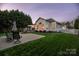 Backyard with patio and deck at dusk at 1108 Butterburr Dr, Matthews, NC 28104