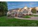 Backyard with deck and patio at 1108 Butterburr Dr, Matthews, NC 28104